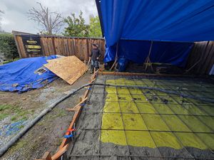 Pouring Concrete Across the Prepared Foundation Grid