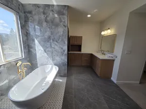 Glamorous Bathroom with Tub and Modern Fixtures
