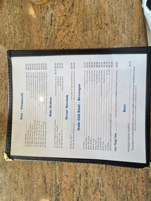 A photo of the menu showing the rice vermicelli options along with side orders like fried shrimp cakes and other house specialties.