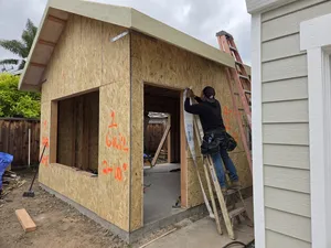 Framing Setup – Workers Fine-Tuning the Structure Before Final Inspection
