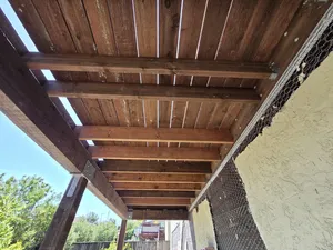 Underdeck framing view with completed wood beams
