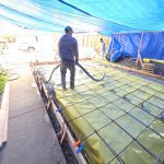 Beginning of Concrete Pour Over Vapor Barrier