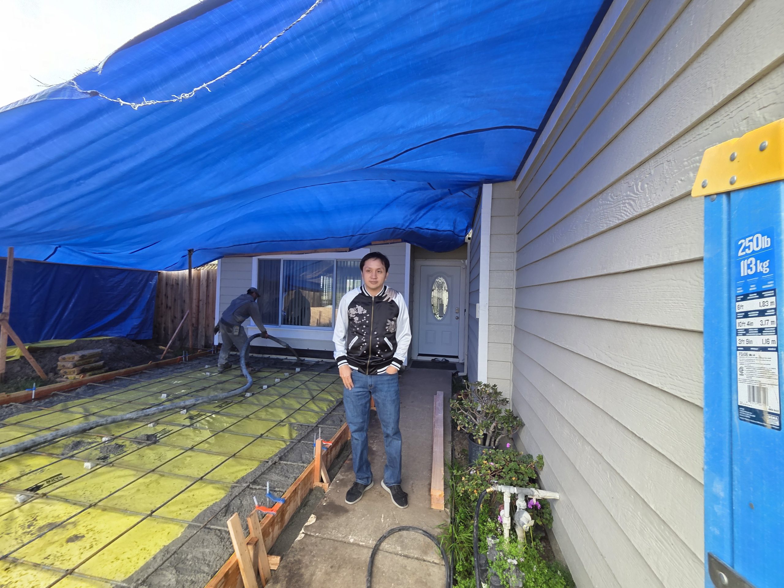 On-Site Supervisor Overseeing Concrete Work Progress
