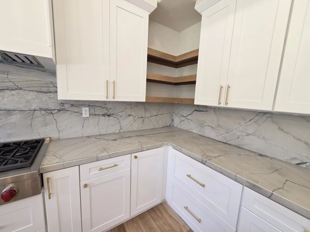 9Builders: Modern Open Concept Kitchen with Spacious Layout and Marble Countertops